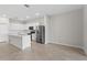 Bright, open kitchen with stainless steel appliances and a large island at 2731 Winding Creek Trl, North Port, FL 34289