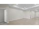 Open living area with recessed lighting and neutral walls at 2731 Winding Creek Trl, North Port, FL 34289