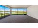 Covered lanai features beautiful brick pavers and a serene view of the lush pond and landscape at 2731 Winding Creek Trl, North Port, FL 34289