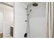 Bathroom shower featuring white subway tiles and a rainfall shower head fixture at 3202 W Coachman Ave, Tampa, FL 33611