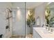 Beautiful bathroom features a glass shower, modern fixtures, marble vanity, and neutral decor at 3202 W Coachman Ave, Tampa, FL 33611