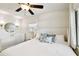 Beautiful bedroom with a ceiling fan, light walls, and comfortable bed create a relaxing retreat at 3202 W Coachman Ave, Tampa, FL 33611