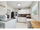 Functional laundry room with ample storage and modern appliances at 3202 W Coachman Ave, Tampa, FL 33611