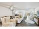 Comfortable living room with ceiling fan, sliding barn door, and view to backyard at 3202 W Coachman Ave, Tampa, FL 33611