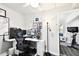 Office space featuring multiple monitors, neutral paint and decor, and an adjacent exercise area at 3202 W Coachman Ave, Tampa, FL 33611