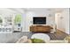 Bright play room features large TV and view of backyard at 3202 W Coachman Ave, Tampa, FL 33611