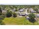 Bird's eye view of the home showcasing a large, fenced backyard, and mature trees at 3257 Masonville Loop, Holiday, FL 34691