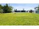 Large backyard with ample space, ideal for gardening or entertaining with a patio and fenced perimeter at 3257 Masonville Loop, Holiday, FL 34691