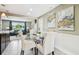 Cozy dining room with stylish furnishings and artwork, perfect for intimate gatherings at 3257 Masonville Loop, Holiday, FL 34691