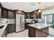Stylish kitchen featuring stainless steel appliances, granite countertops, and ample cabinet space at 3257 Masonville Loop, Holiday, FL 34691
