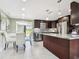 Modern kitchen featuring stainless steel appliances, granite countertops, and ample storage at 3257 Masonville Loop, Holiday, FL 34691