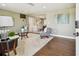 Inviting living room with hardwood floors, neutral walls, and a glimpse into the dining area at 3257 Masonville Loop, Holiday, FL 34691