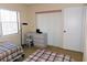 Bedroom featuring twin beds, soft lighting, a desk and neutral tones at 337 Woodlake Wynde, Oldsmar, FL 34677