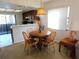 Cozy dining area with a wooden table and access to the kitchen and patio at 337 Woodlake Wynde, Oldsmar, FL 34677