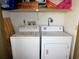 Convenient laundry area with a standard washer and dryer for easy chore completion at 337 Woodlake Wynde, Oldsmar, FL 34677