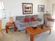 Cozy living room featuring a neutral color palette and comfortable seating arrangement at 337 Woodlake Wynde, Oldsmar, FL 34677
