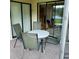 Enjoy outdoor dining on this screened lanai with sliding glass door and views at 337 Woodlake Wynde, Oldsmar, FL 34677