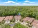 Aerial view of the property showcasing its location surrounded by lush greenery and well-maintained landscaping at 3810 Darston St, Palm Harbor, FL 34685