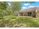 Beautiful backyard with a spacious screened-in lanai, perfect for outdoor relaxation and entertaining at 3810 Darston St, Palm Harbor, FL 34685