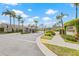 Community entrance to Salem Village is framed by lush tropical landscaping and tall palms at 3810 Darston St, Palm Harbor, FL 34685