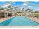 Community pool offering a refreshing escape with comfortable lounge chairs and clear water at 3810 Darston St, Palm Harbor, FL 34685