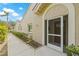 Home's inviting front entrance features desert landscaping and a textured stucco exterior at 3810 Darston St, Palm Harbor, FL 34685