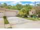 Inviting single-story home with a well-maintained lawn, a two-car garage, and a charming barrel tile roof at 3810 Darston St, Palm Harbor, FL 34685