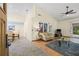 Spacious living room featuring tile flooring, vaulted ceilings, and sliding door access to the screened porch at 3810 Darston St, Palm Harbor, FL 34685