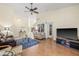 Well-lit living room with high ceilings, hardwood floors, and stylish decor creating a warm atmosphere at 3810 Darston St, Palm Harbor, FL 34685