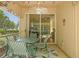 Outdoor patio with a screened-in porch and a view into the interior living space at 3810 Darston St, Palm Harbor, FL 34685