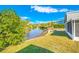 Serene backyard view of a canal surrounded by lush greenery, offering a peaceful and private outdoor space at 4508 26Th S Ave, Tampa, FL 33619