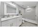 This modern bathroom features double sinks, sleek cabinets, and a tiled shower with stylish accents at 4508 26Th S Ave, Tampa, FL 33619