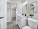 Bathroom vanity with modern sink, cabinets, decorative mirror, and a plant that add a touch of nature at 4508 26Th S Ave, Tampa, FL 33619