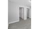 A neutral bedroom featuring wood-look floors, and doorways into the bathroom and closet at 4508 26Th S Ave, Tampa, FL 33619