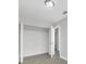 Open closet in a bedroom with neutral-colored walls and wood-look tile flooring at 4508 26Th S Ave, Tampa, FL 33619