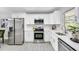 Kitchen features stainless appliances, white cabinetry, and modern countertops at 4508 26Th S Ave, Tampa, FL 33619