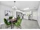 Bright eat-in kitchen features stainless appliances, white cabinetry, and wood-look tile floors at 4508 26Th S Ave, Tampa, FL 33619