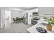 Modern kitchen with stainless steel appliances, white cabinets, and an adjacent dining area at 4508 26Th S Ave, Tampa, FL 33619