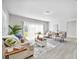 Bright living room with neutral furniture, light wood floors, and sliding glass doors at 4508 26Th S Ave, Tampa, FL 33619