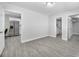 The open living room seamlessly connects to the kitchen and bathroom, enhancing modern home design at 4508 26Th S Ave, Tampa, FL 33619