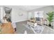 Inviting living room with modern decor, wood-look floors, and ample natural light from the windows at 4508 26Th S Ave, Tampa, FL 33619