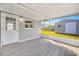 Cozy screened porch with ample sunlight, neutral paint, and outdoor access, ideal for relaxation at 4508 26Th S Ave, Tampa, FL 33619