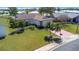 Aerial view of home showcasing well-kept lawn and landscaping, emphasizing its curb appeal at 4534 Great Lakes S Dr, Clearwater, FL 33762