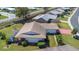Overhead view of the home highlighting the screened patio and surrounding green spaces in the neighborhood at 4534 Great Lakes S Dr, Clearwater, FL 33762