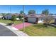 Aerial front view of home, with a well-manicured lawn and a painted driveway at 4534 Great Lakes S Dr, Clearwater, FL 33762