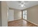 This bedroom features wood floors, a ceiling fan, and a window for natural light at 4534 Great Lakes S Dr, Clearwater, FL 33762