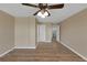 Spacious bedroom featuring wood-look flooring and a ceiling fan with lighting at 4534 Great Lakes S Dr, Clearwater, FL 33762