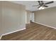 This bedroom has wood floors and doorways to other rooms at 4534 Great Lakes S Dr, Clearwater, FL 33762