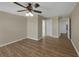 A spacious bedroom with wood floors and entryways to other rooms at 4534 Great Lakes S Dr, Clearwater, FL 33762
