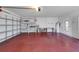 Spacious two car garage with painted floor and shelving for storage at 4534 Great Lakes S Dr, Clearwater, FL 33762